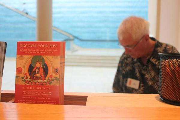 The fliers about the exhibition is placed on the information desk in Blanton Museum of Art. 